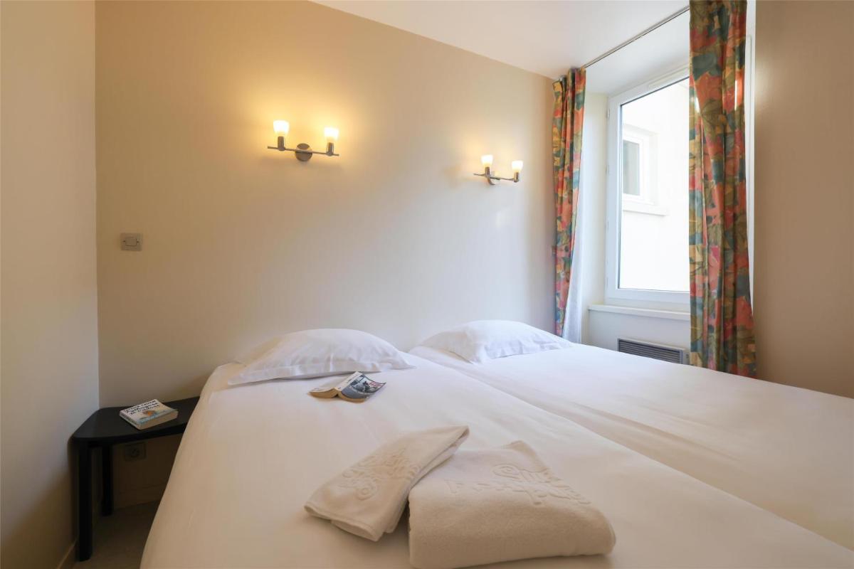 Un ou plusieurs lits dans un hébergement de l'établissement Best Western Grand Hotel de Paris & Spa