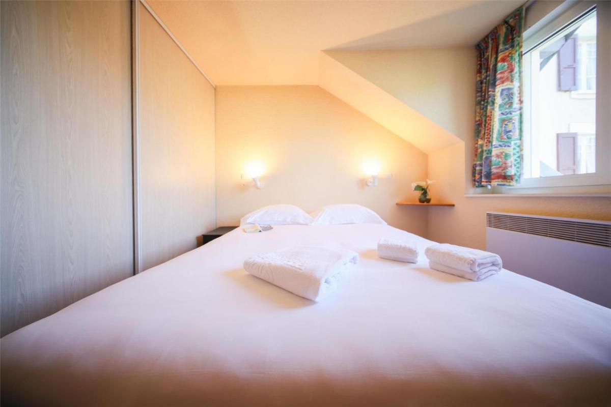Un ou plusieurs lits dans un hébergement de l'établissement Best Western Grand Hotel de Paris & Spa