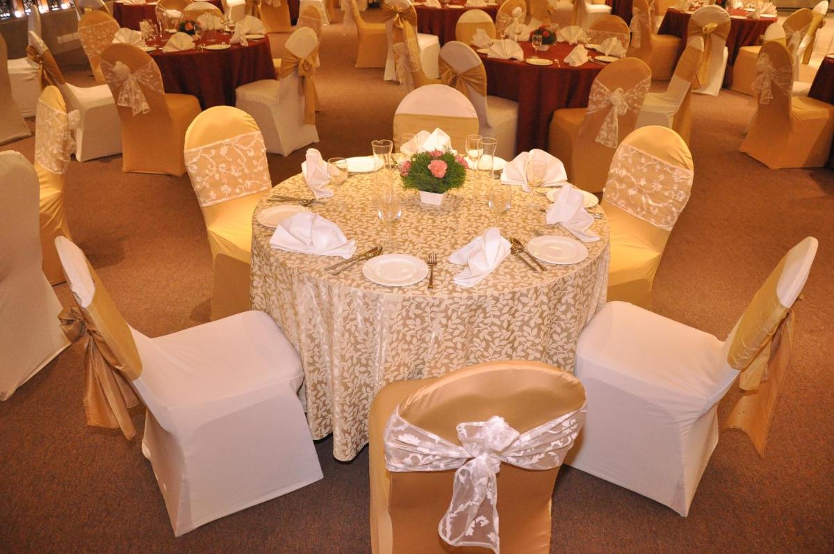 a table and chairs in a banquet hall at Radisson Hotel Shimla in Shimla