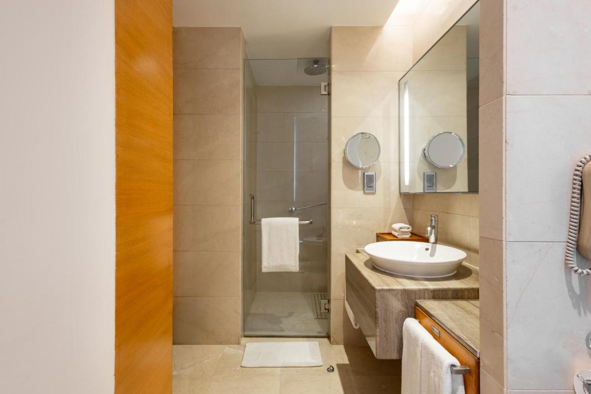 a bathroom with a sink and a shower at Hyatt Pune in Pune