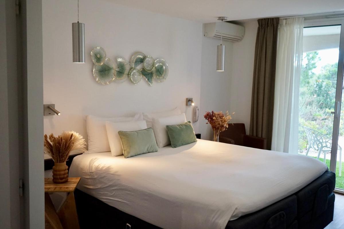 Un ou plusieurs lits dans un hébergement de l'établissement Côté Thalasso Hôtel & Spa Marin
