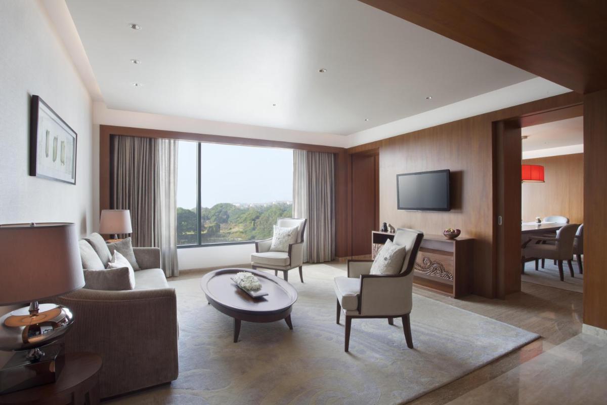 a living room with a couch and chairs and a table at Park Hyatt Chennai in Chennai