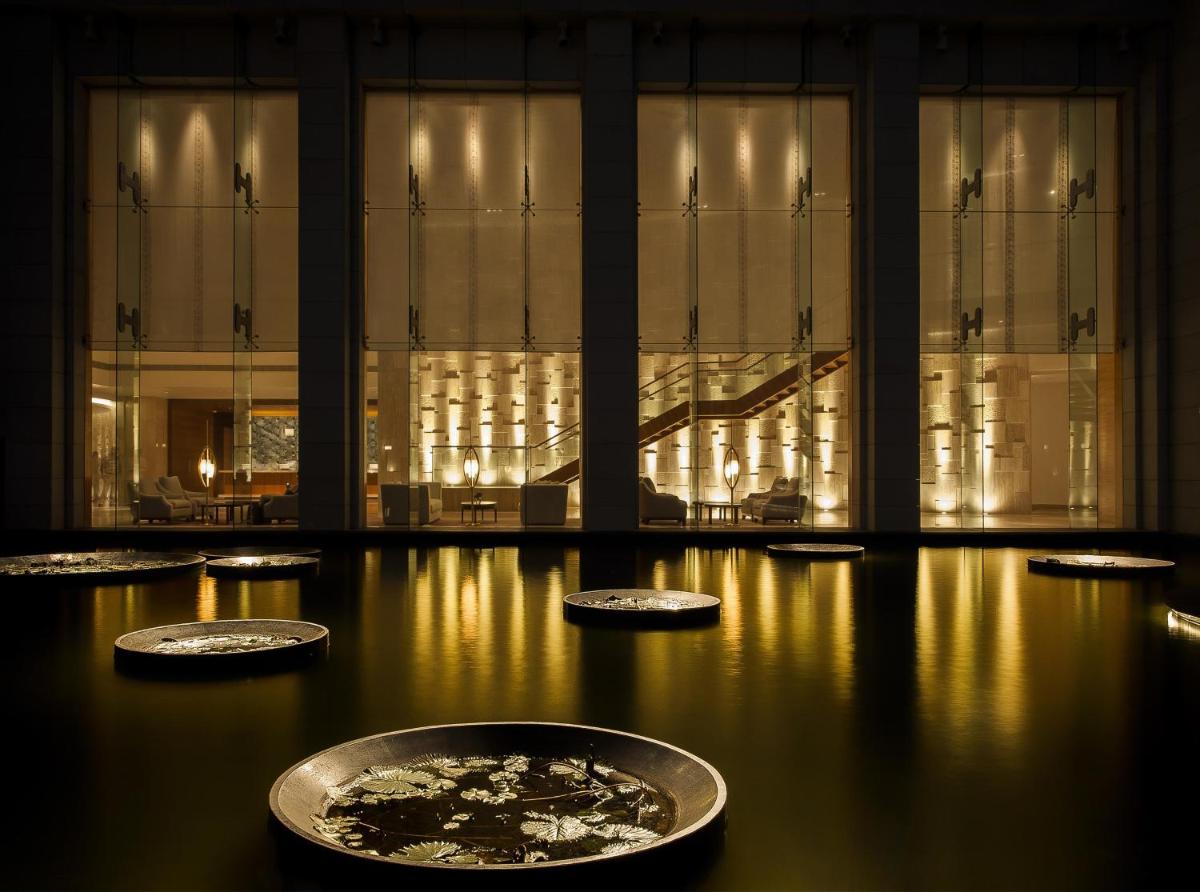 a room with four bowls on the floor of a building at Park Hyatt Chennai in Chennai