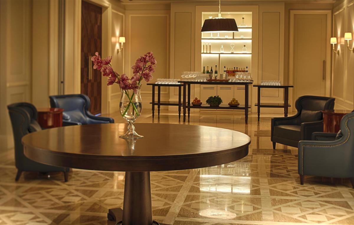 a vase of flowers on a table in a lobby at Park Hyatt Chennai in Chennai