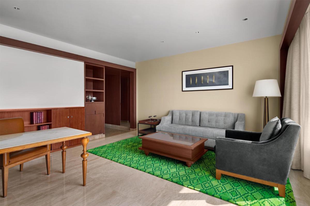 a living room with a couch and a table at Park Hyatt Chennai in Chennai
