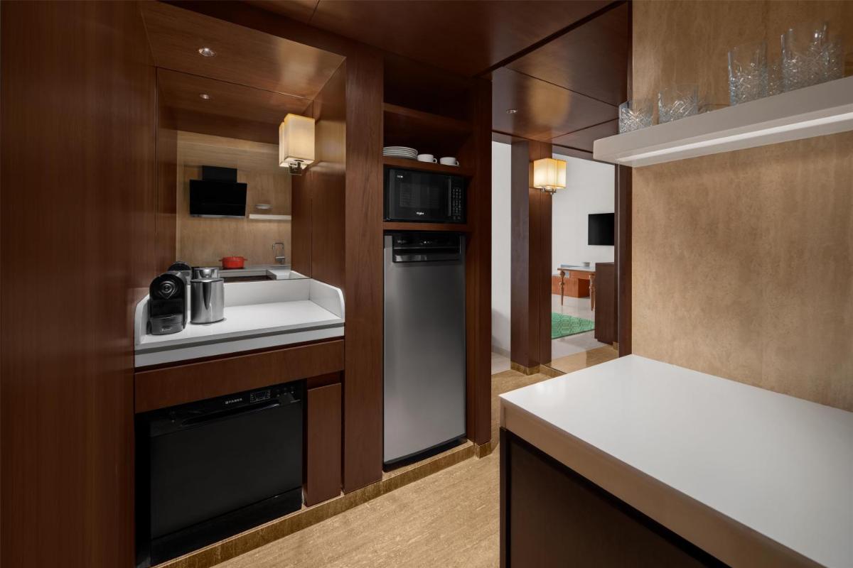a kitchen with a sink and a dishwasher at Park Hyatt Chennai in Chennai