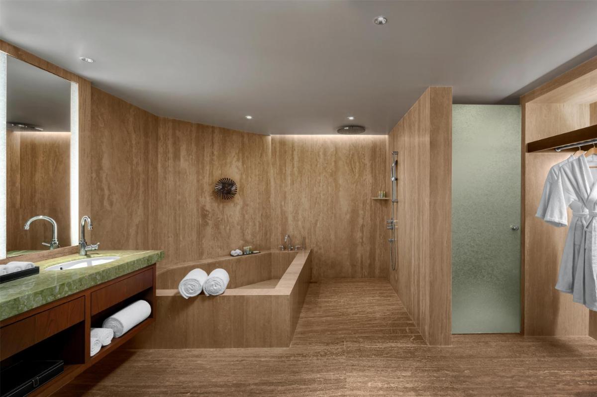 a bathroom with a sink and a shower at Park Hyatt Chennai in Chennai