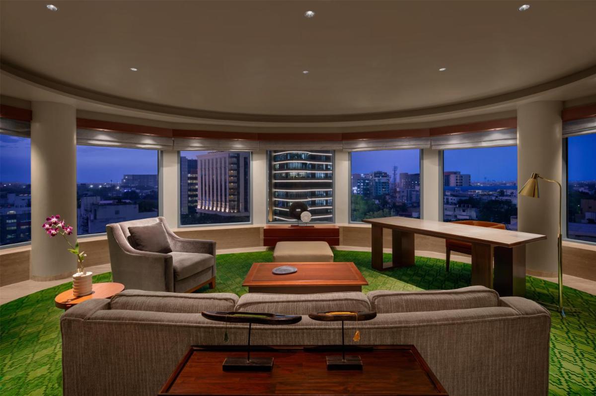 a living room with a couch and a table at Park Hyatt Chennai in Chennai