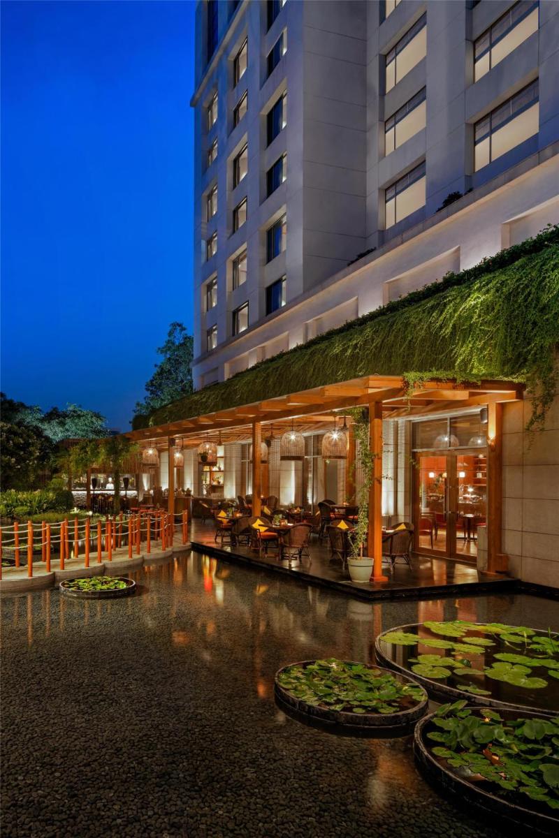 a hotel with a pool of water in front of a building at Park Hyatt Chennai in Chennai