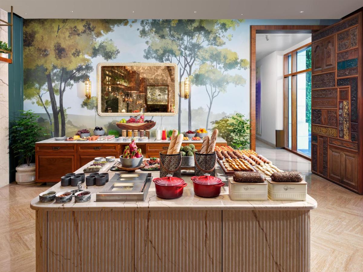 a buffet of food on a table in a room at Park Hyatt Chennai in Chennai