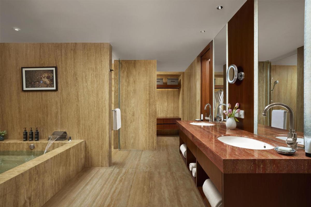 a bathroom with a sink and a shower at Park Hyatt Chennai in Chennai