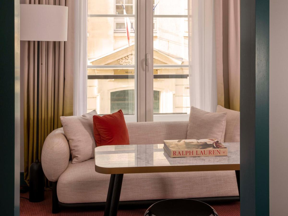 Coin salon dans l'établissement Hôtel Bel Ami