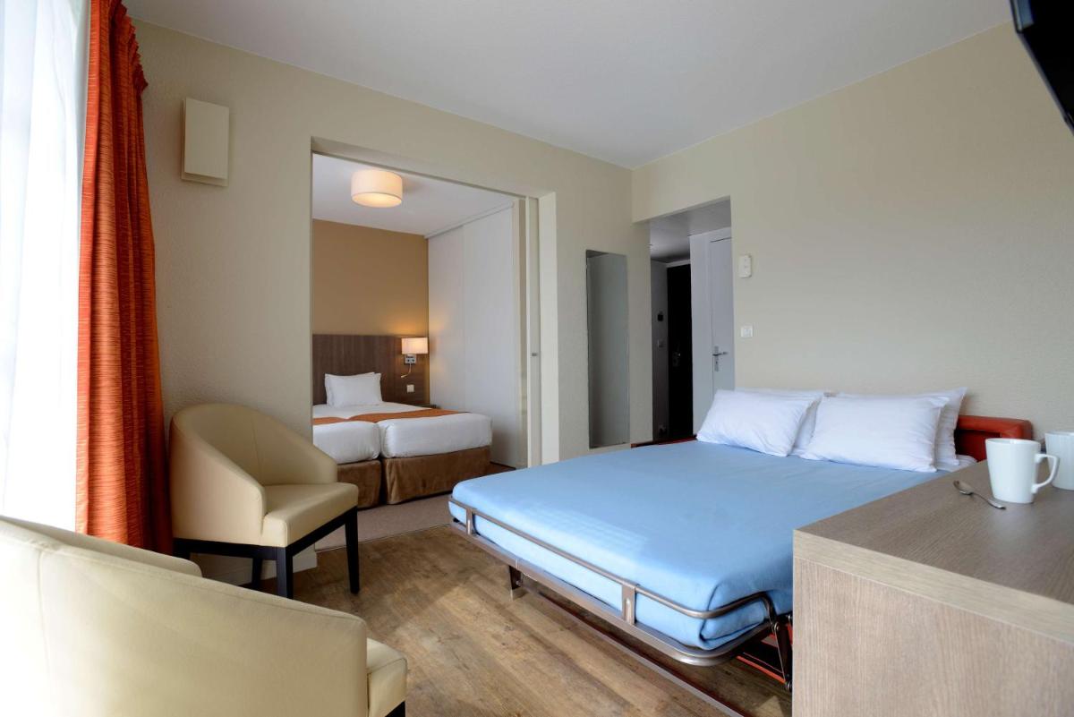 Un ou plusieurs lits dans un hébergement de l'établissement Best Western Hotel Sourcéo