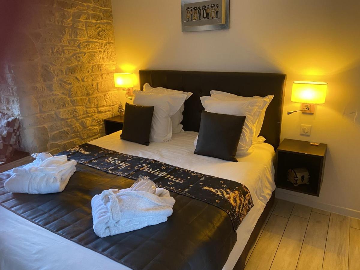 Un ou plusieurs lits dans un hébergement de l'établissement Le Moulin d'Oscar & Spa - Mulhouse Nord