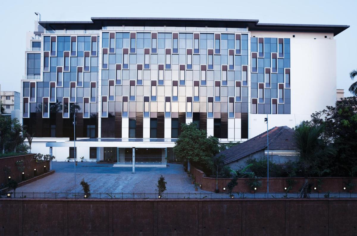 a large white building with a lot of windows at Vivanta Goa, Panaji in Panaji