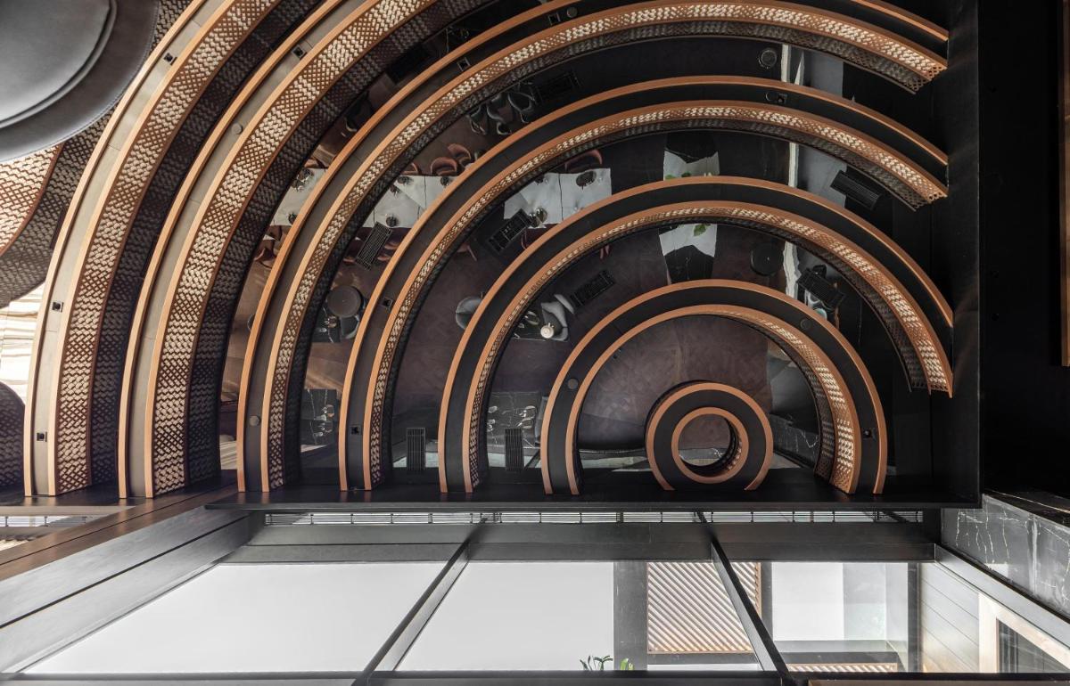 a spiral staircase in a building at Radisson Blu Hotel Pune Kharadi in Pune