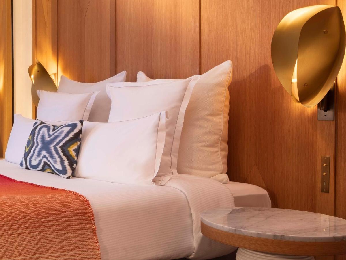 Un ou plusieurs lits dans un hébergement de l'établissement Hôtel Vernet Champs Elysées Paris