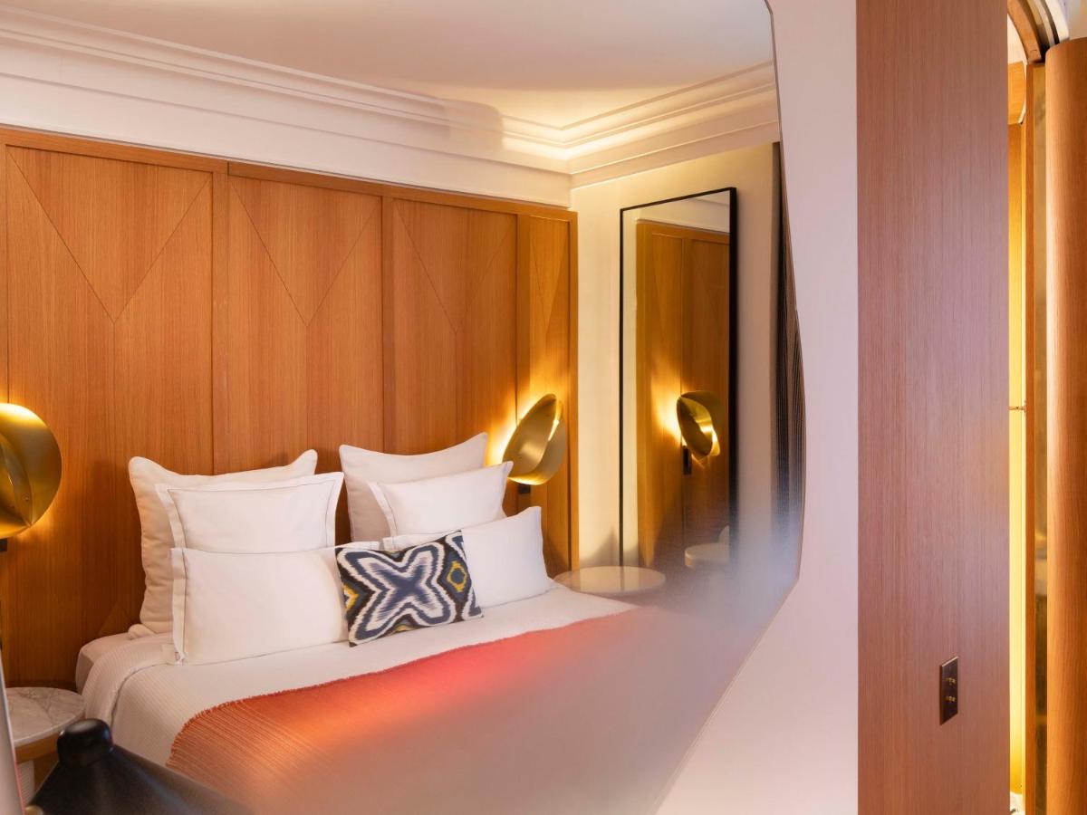 Un ou plusieurs lits dans un hébergement de l'établissement Hôtel Vernet Champs Elysées Paris