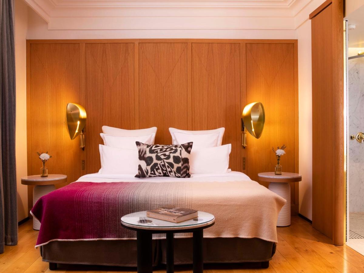 Un ou plusieurs lits dans un hébergement de l'établissement Hôtel Vernet Champs Elysées Paris