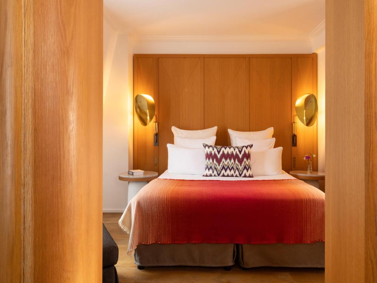 Un ou plusieurs lits dans un hébergement de l'établissement Hôtel Vernet Champs Elysées Paris