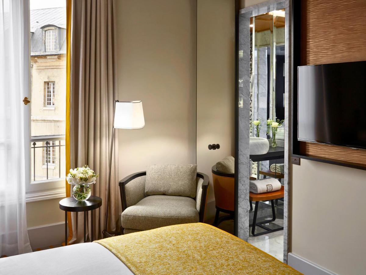 Un ou plusieurs lits dans un hébergement de l'établissement Hotel Montalembert