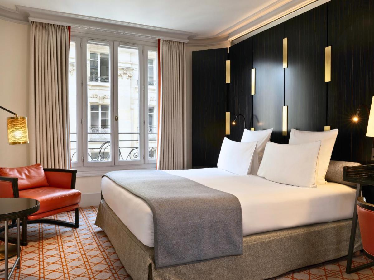 Un ou plusieurs lits dans un hébergement de l'établissement Hotel Montalembert