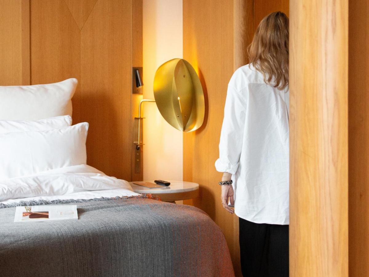 Un ou plusieurs lits dans un hébergement de l'établissement Hôtel Vernet Champs Elysées Paris