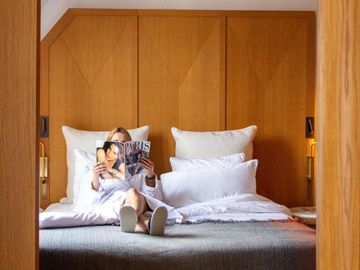 Un ou plusieurs lits dans un hébergement de l'établissement Hôtel Vernet Champs Elysées Paris