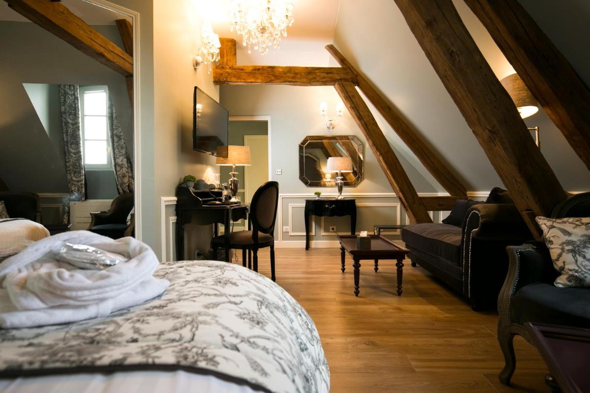Un ou plusieurs lits dans un hébergement de l'établissement Hotel & Spa Le Grand Monarque, BW Premier Collection