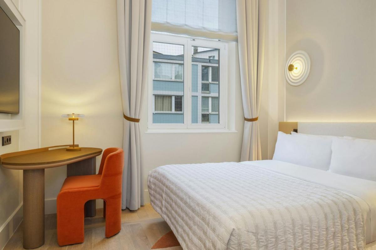Ein Bett oder Betten in einem Zimmer der Unterkunft Le Méridien Frankfurt