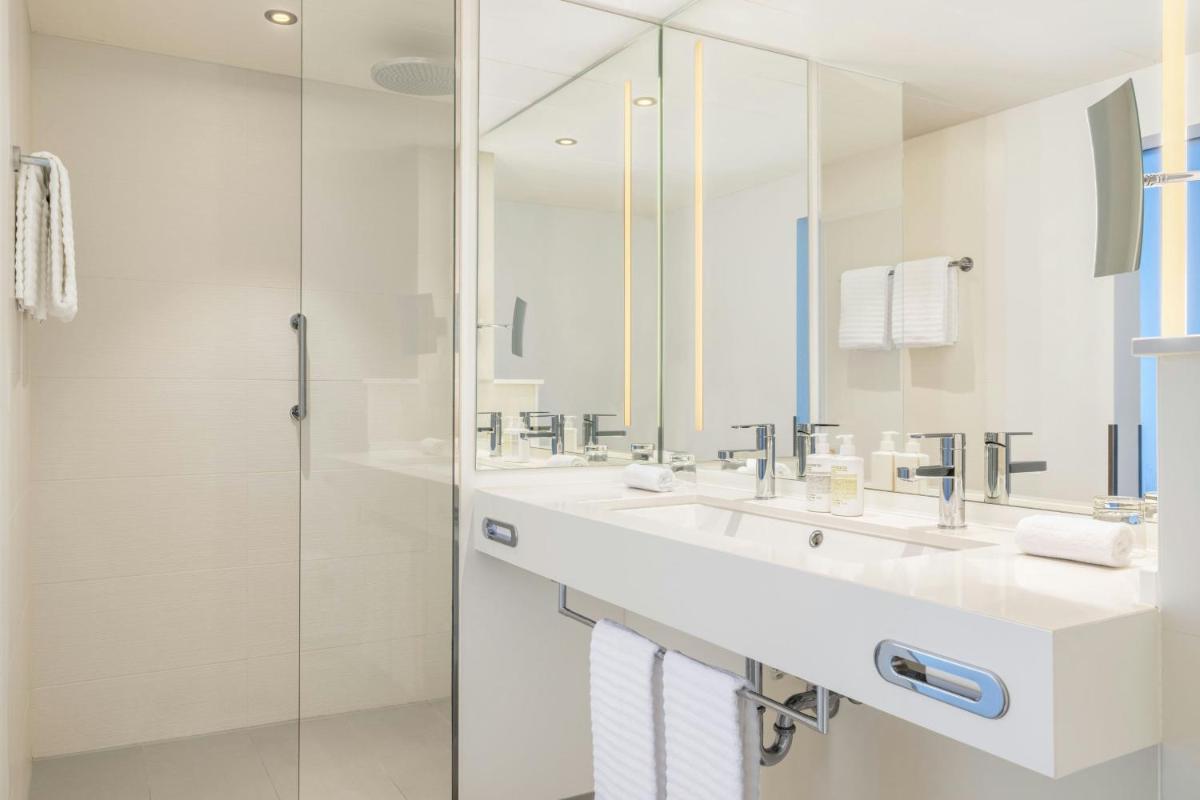 Ein Badezimmer in der Unterkunft Le Méridien Frankfurt