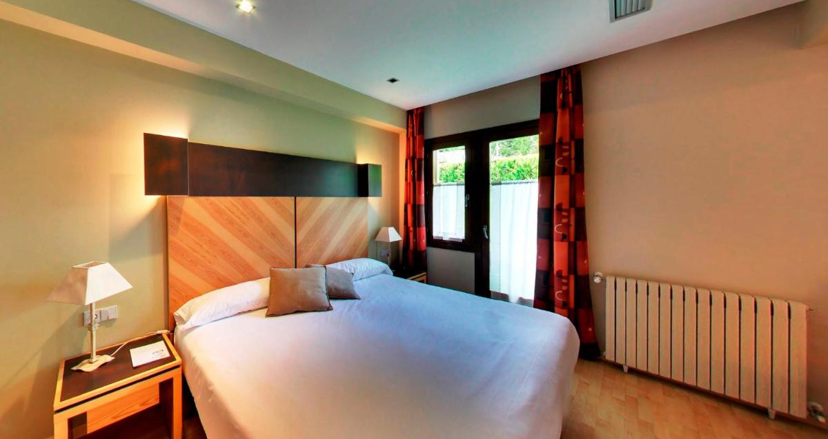 Cama o camas de una habitación en Silken Ordesa