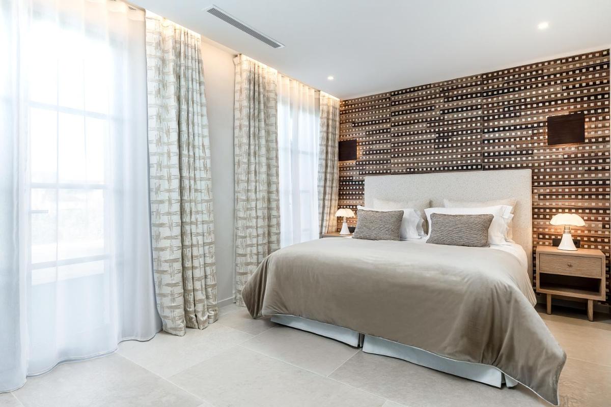 Un ou plusieurs lits dans un hébergement de l'établissement Villa Cosy, hotel & spa