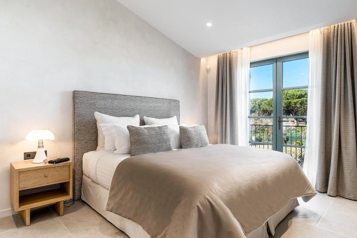 Un ou plusieurs lits dans un hébergement de l'établissement Villa Cosy, hotel & spa