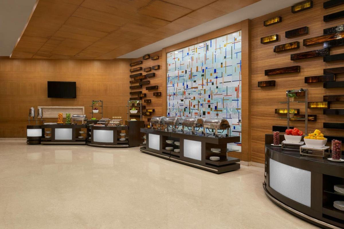a store with a large window with wine bottles at Meluha The Fern Mumbai, Powai, Series by Marriott in Mumbai