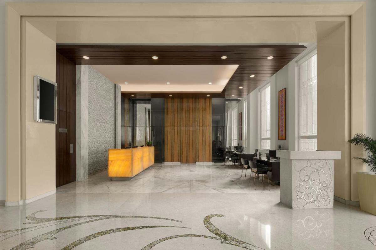 a lobby with a conference room with tables and chairs at Meluha The Fern Mumbai, Powai, Series by Marriott in Mumbai