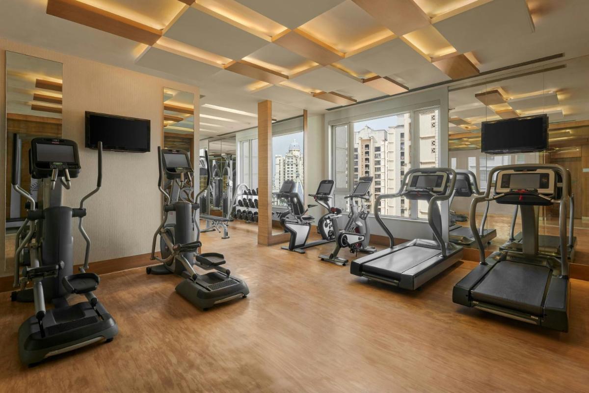 a gym with a bunch of exercise bikes in it at Meluha The Fern Mumbai, Powai, Series by Marriott in Mumbai