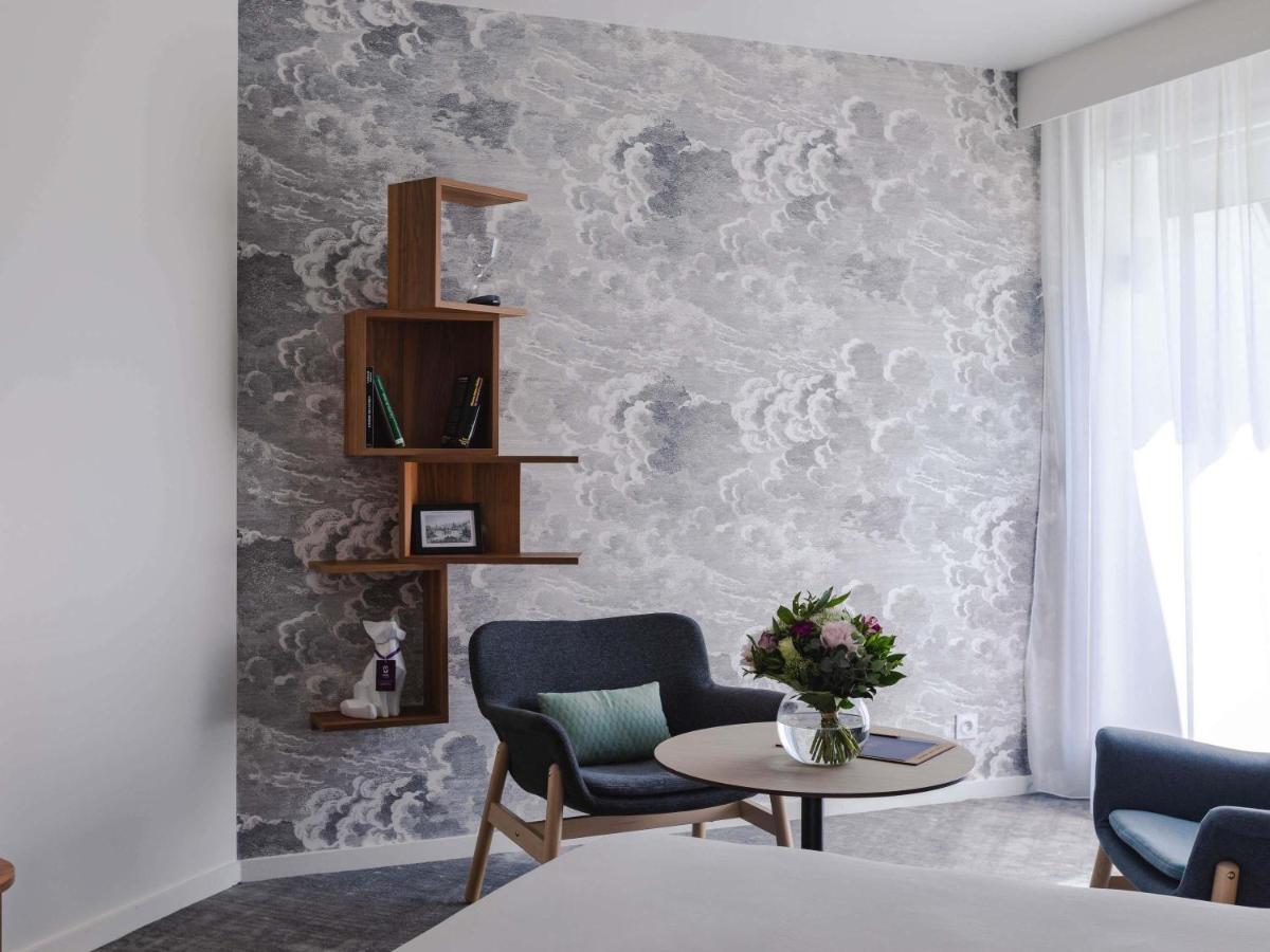 Coin salon dans l'établissement Mercure Aix-les-Bains Domaine de Marlioz Hôtel & Spa