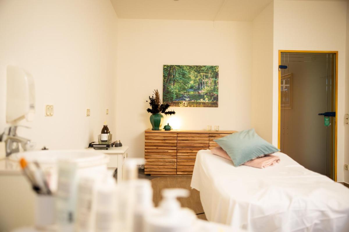 Ein Bett oder Betten in einem Zimmer der Unterkunft Mühl Vital Resort