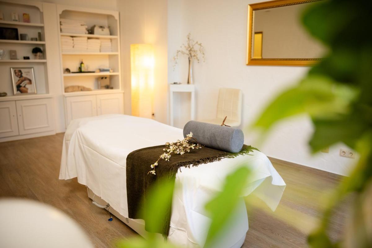 Ein Bett oder Betten in einem Zimmer der Unterkunft Mühl Vital Resort