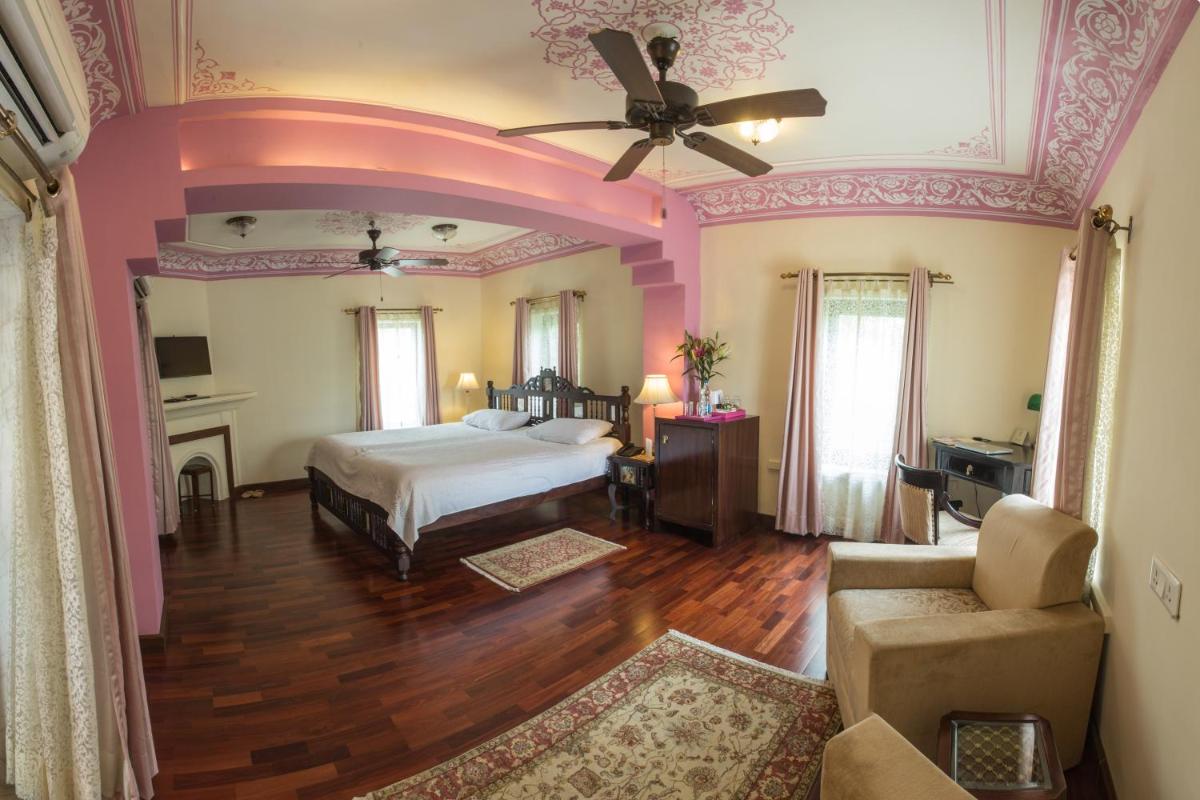 a bedroom with a bed and a ceiling at Royal Heritage Haveli - By Leisure Hotels in Jaipur
