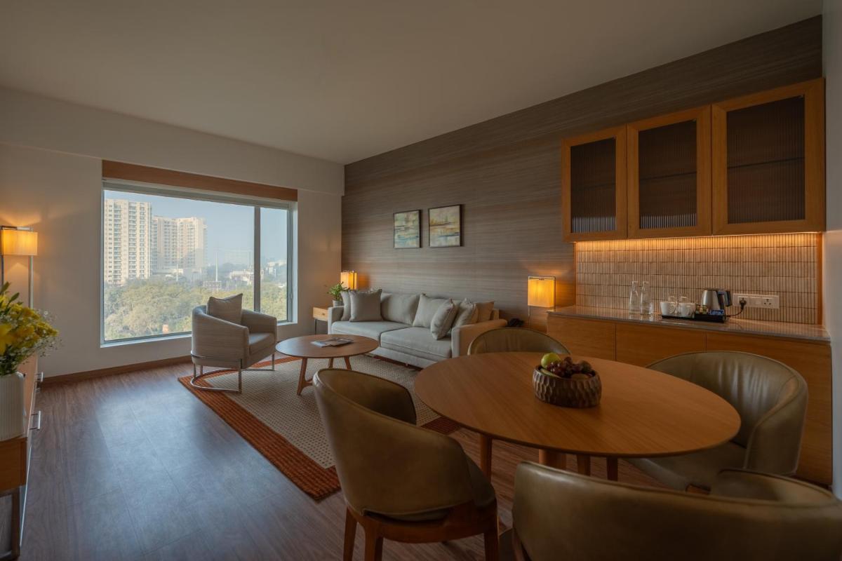 a living room with a couch and a table at Hyatt Place Gurgaon Udyog Vihar in Gurgaon a living room with a couch and a table at Hyatt Place Gurgaon Udyog Vihar in Gurgaon