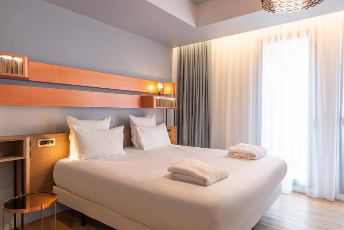 Un ou plusieurs lits dans un hébergement de l'établissement Golden Tulip Saint Malo– Le Grand Bé