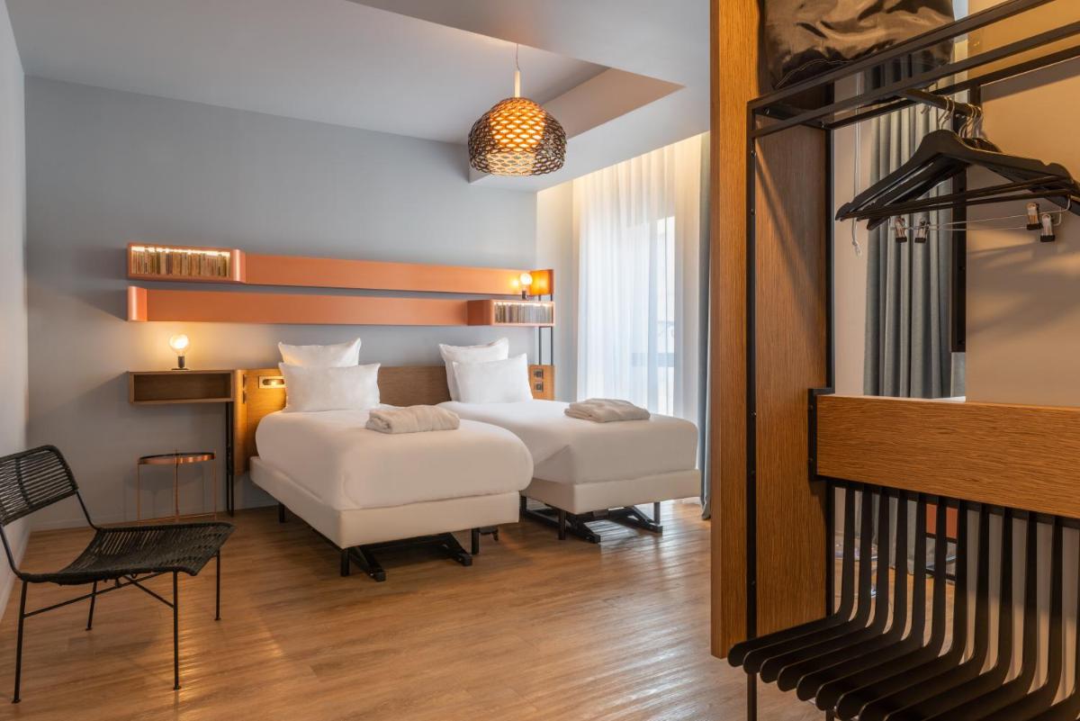 Un ou plusieurs lits dans un hébergement de l'établissement Golden Tulip Saint Malo– Le Grand Bé