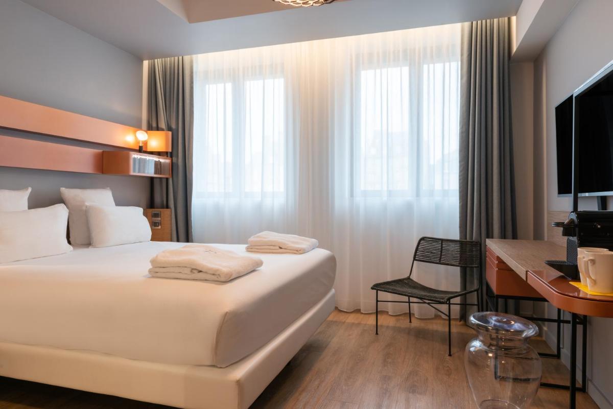 Un ou plusieurs lits dans un hébergement de l'établissement Golden Tulip Saint Malo– Le Grand Bé