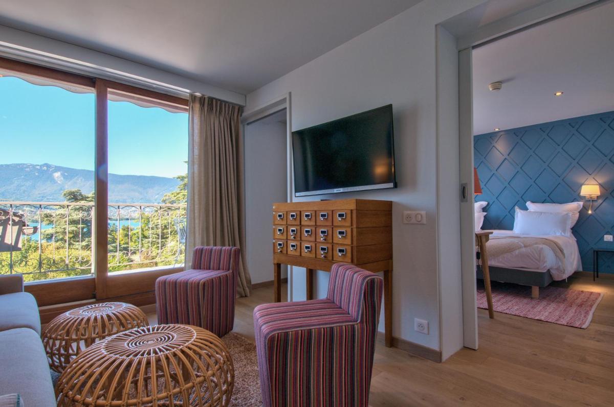 Un ou plusieurs lits dans un hébergement de l'établissement Hôtel Beau Site Talloires B SPA
