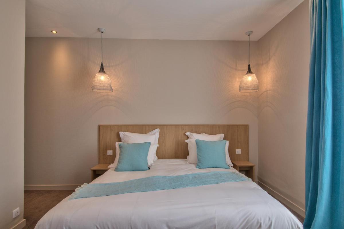 Un ou plusieurs lits dans un hébergement de l'établissement Hôtel Beau Site Talloires B SPA