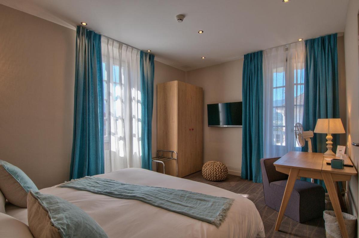 Un ou plusieurs lits dans un hébergement de l'établissement Hôtel Beau Site Talloires B SPA