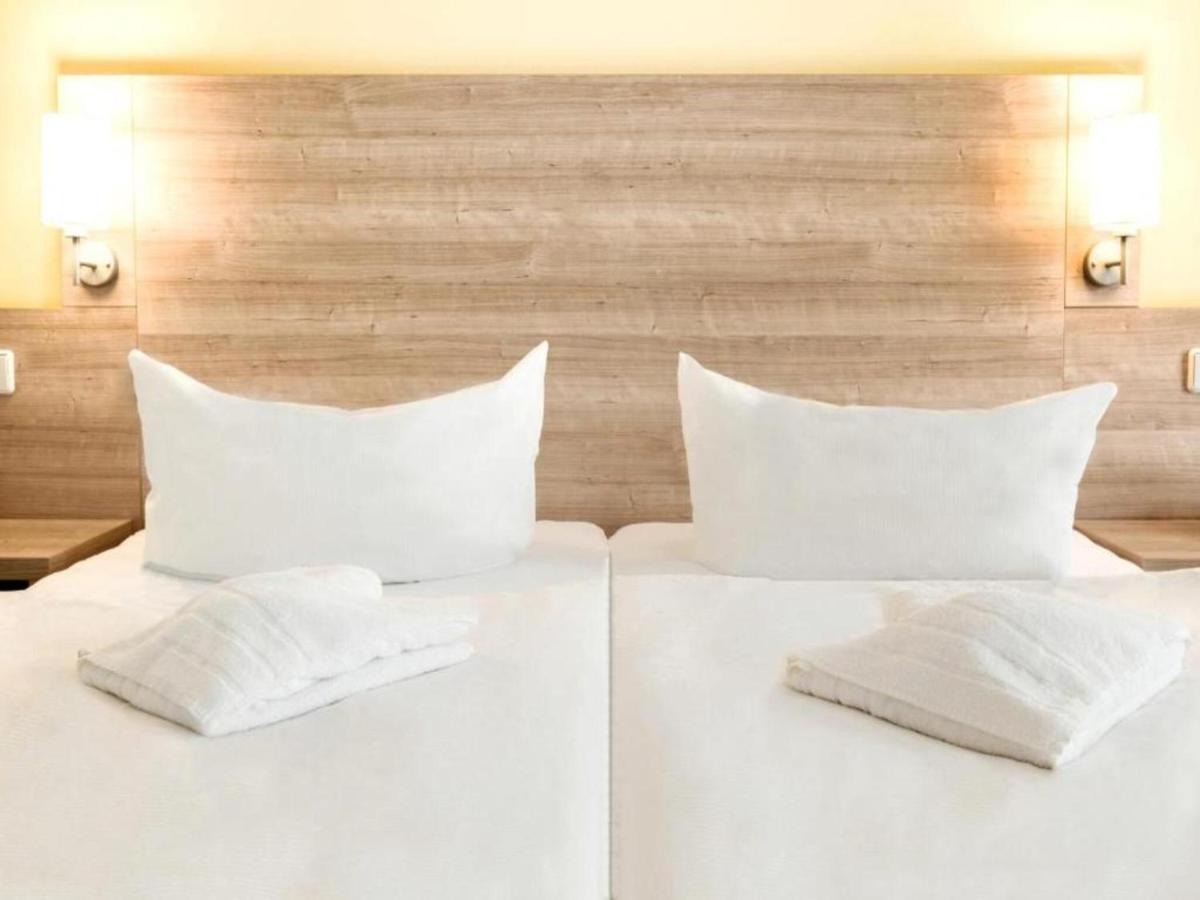 Ein Bett oder Betten in einem Zimmer der Unterkunft Kaiserhof Feldberg by Belvilla Resorts