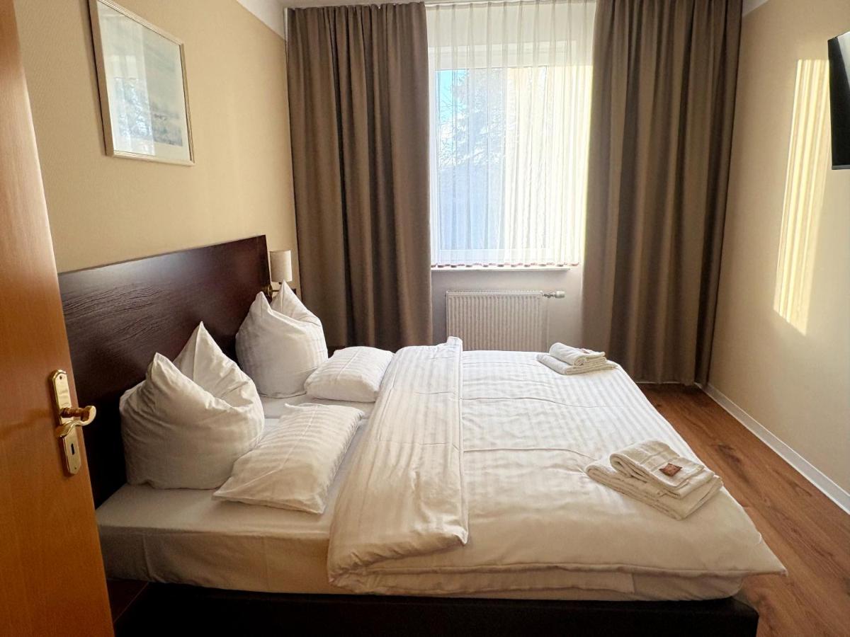 Ein Bett oder Betten in einem Zimmer der Unterkunft Kaiserhof Feldberg by Belvilla Resorts
